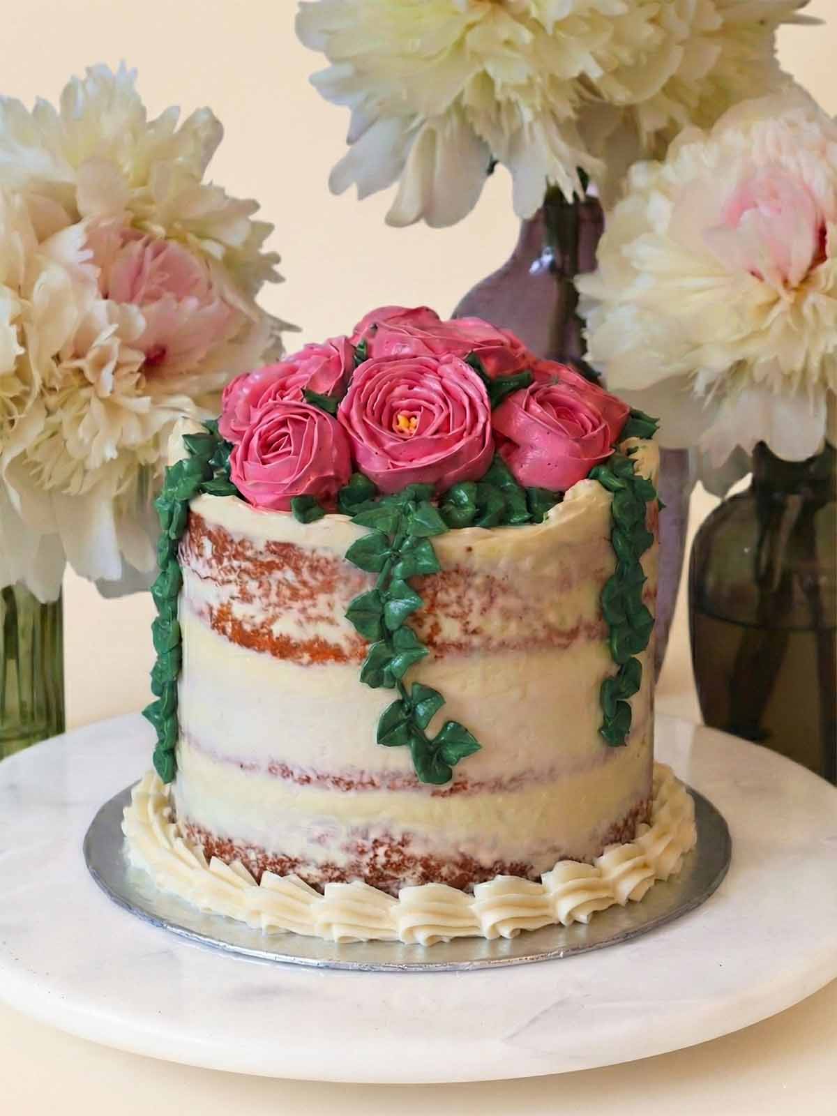 Elegant peony buttercream birthday cake for a 50th celebration