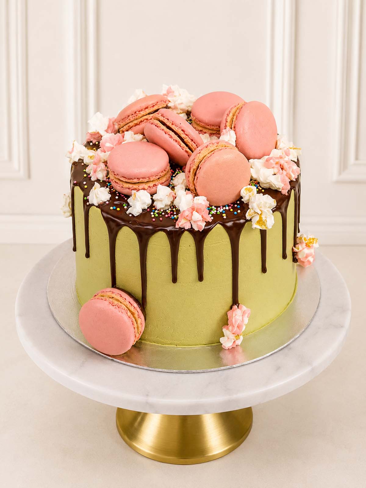 Luxury cherry blossom style matcha cake with pink macarons, London & Surrey.