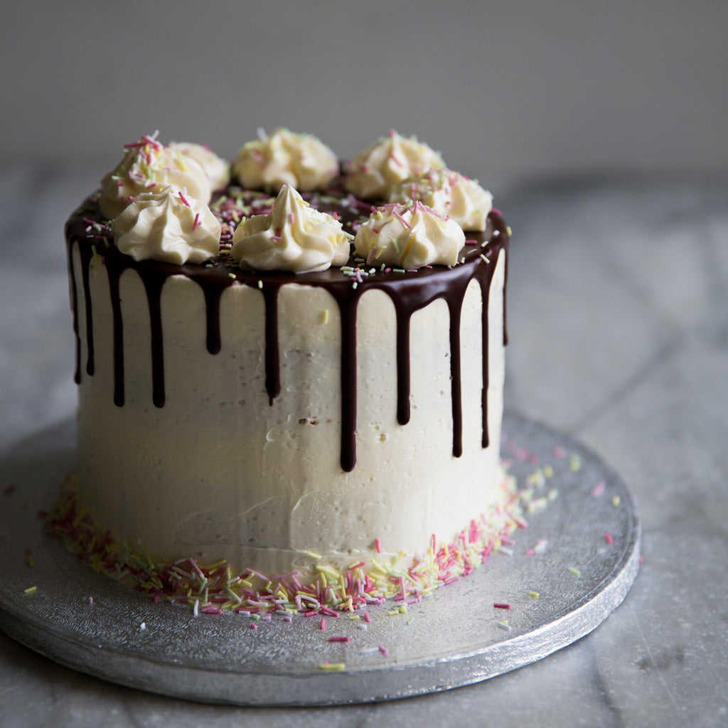 Sue Cakes - Surangie Dias - Simple Birthday Cake Design with Icing flowers  Inside: Ribbon cake with vanilla buttercream frosting #cake #birthday  #birthdaycake #cakestagram #cakelover #dessert | Facebook