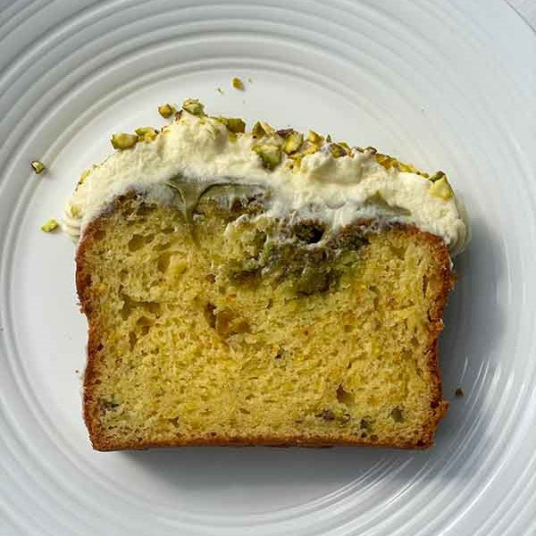 Orange and Pistachio Loaf Cake with Cream Cheese Swiss Meringue Buttercream Slice FEATURE