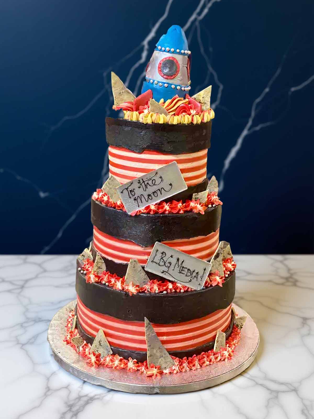 Bespoke corporate cake with rocket design