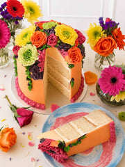 Bright Buttercream Bloom Cake cut to show the vanilla sponge and buttercream layers