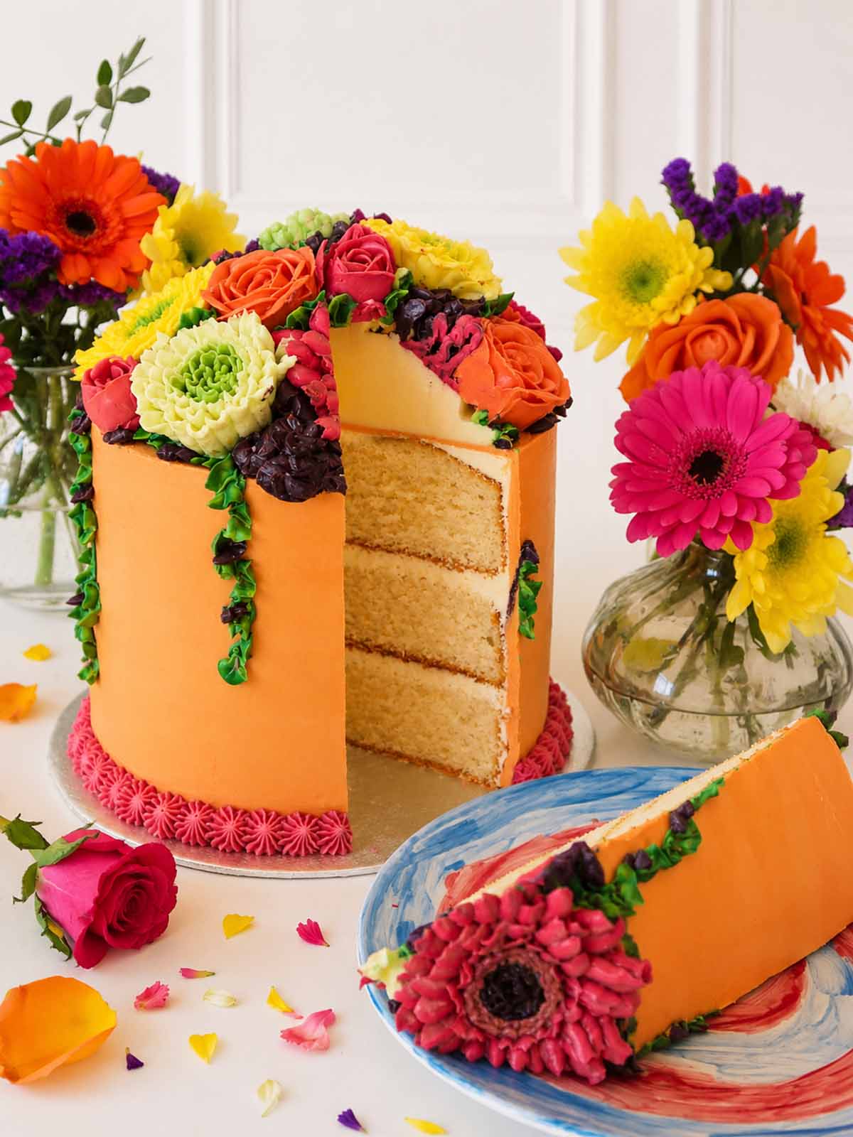 Slice cut from the Bright Buttercream Bloom Cake showing the sponge layers