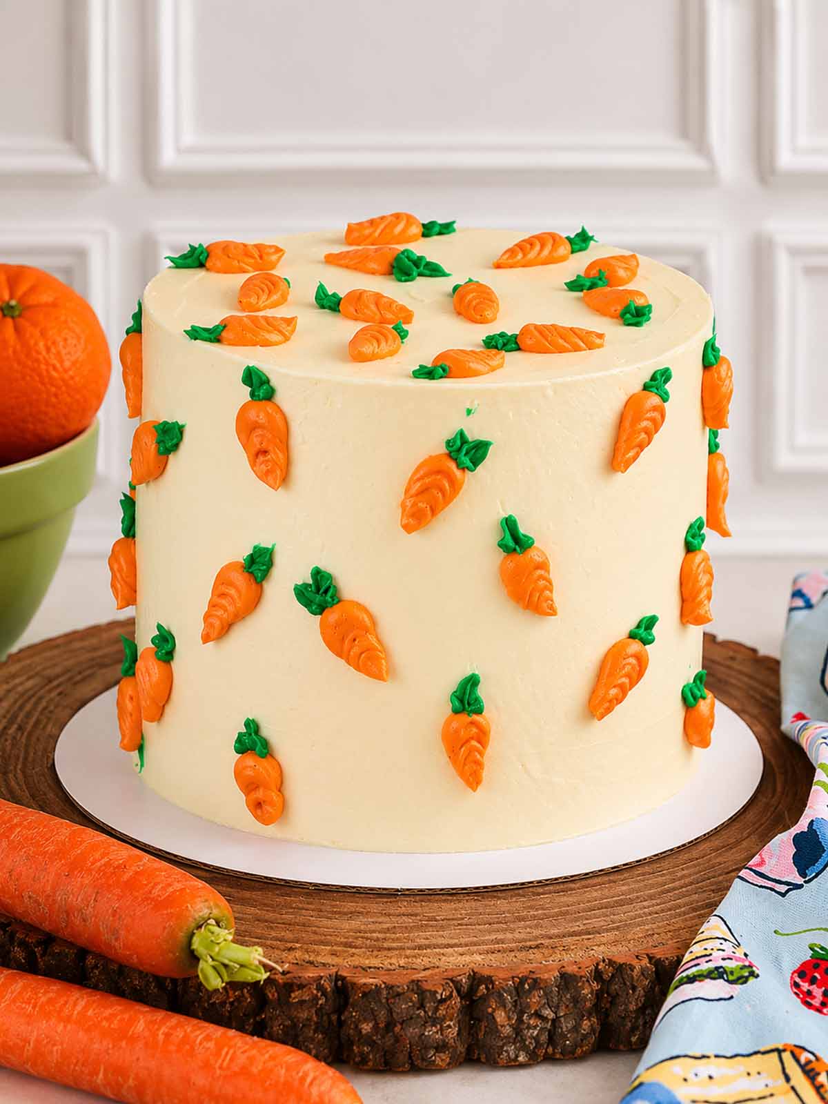 Cake decorated with carrot-shaped candies handmade and delivered in London.