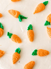 Close up of the Anges de Sucre Carrot Cake showing intricately piped Carrots. 