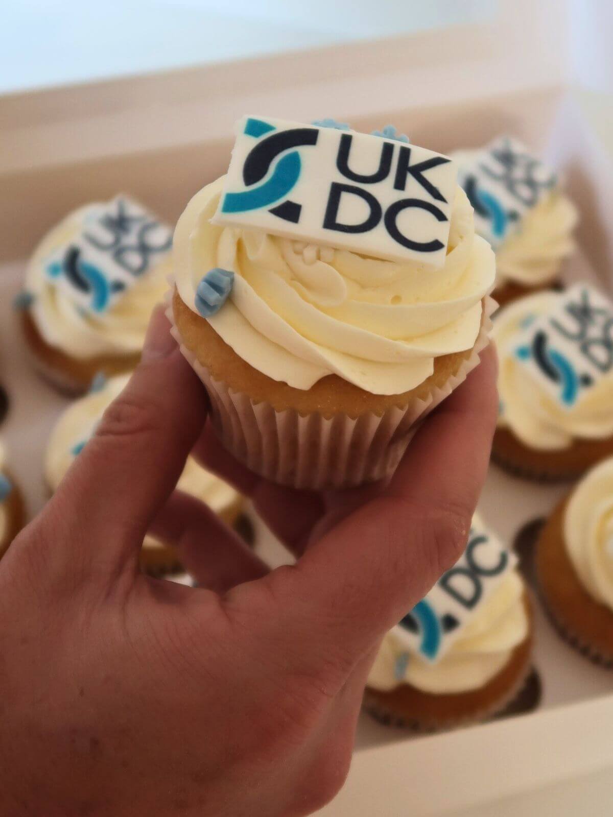 Cupcake with 'UK DC' logo