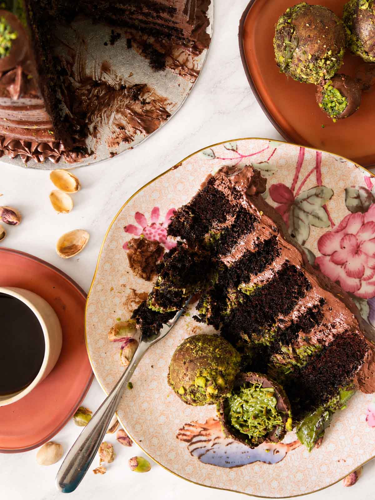 Sliced dubai chocolate cake with green pistachio truffles handmade and delivered in London and Surrey.