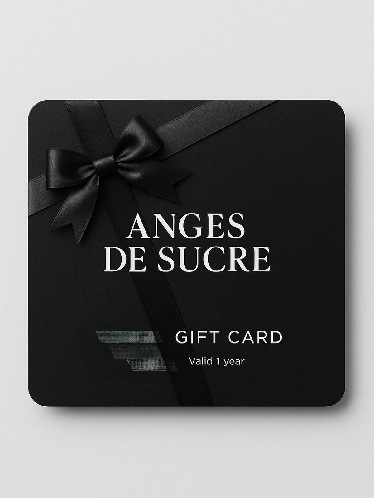 Anges de Sucre gift card with a black ribbon and bow