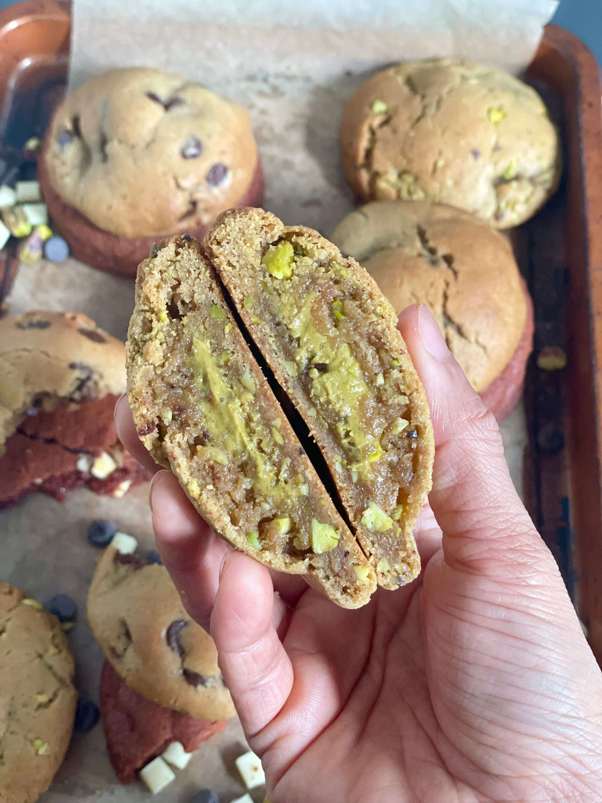 Pistachio Hero Cookie broken open to show the soft centre