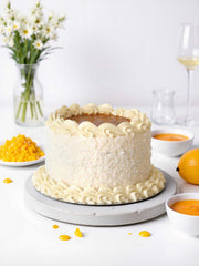 Mango coconut and passion fruit cake with tropical sponge and buttercream, available for cake delivery in London