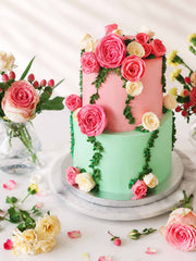 Floral wedding cake with pink and green colours and floral decorations handmade to order in London and Surrey