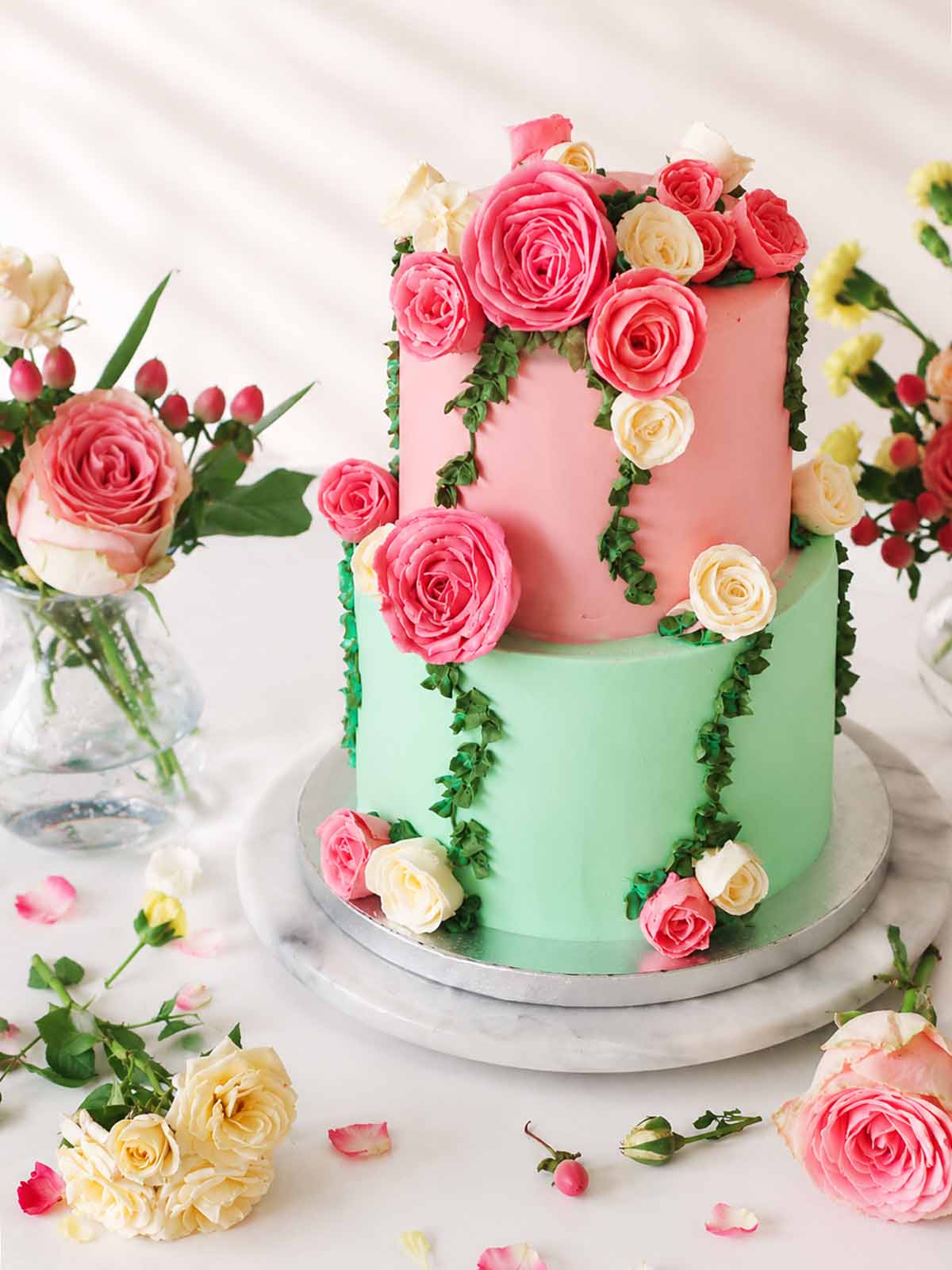 Floral wedding cake with pink and green colours and floral decorations handmade to order in London and Surrey