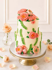 Two-tiered wedding cake decorated with buttercream Peonies and Roses , handmade and delivered in London (M25) and Surrey (UK).