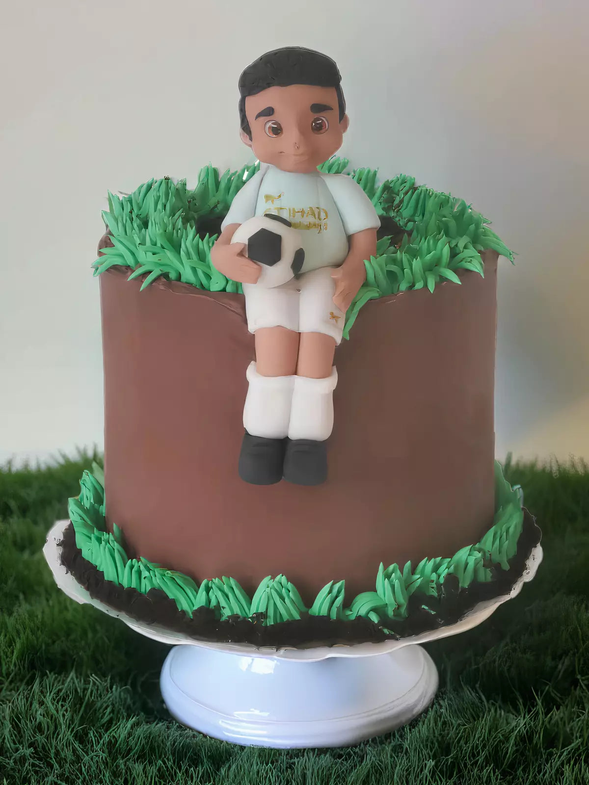 Custom footballer cake with handmade footballer detail for London and Surrey delivery