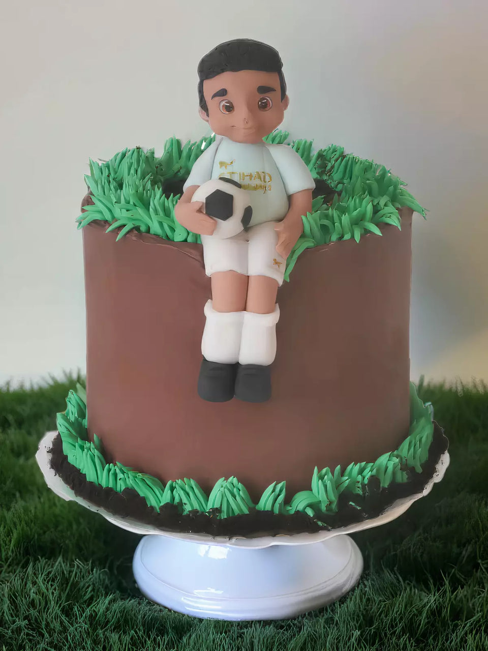 Custom footballer cake with handmade footballer detail for London and Surrey delivery