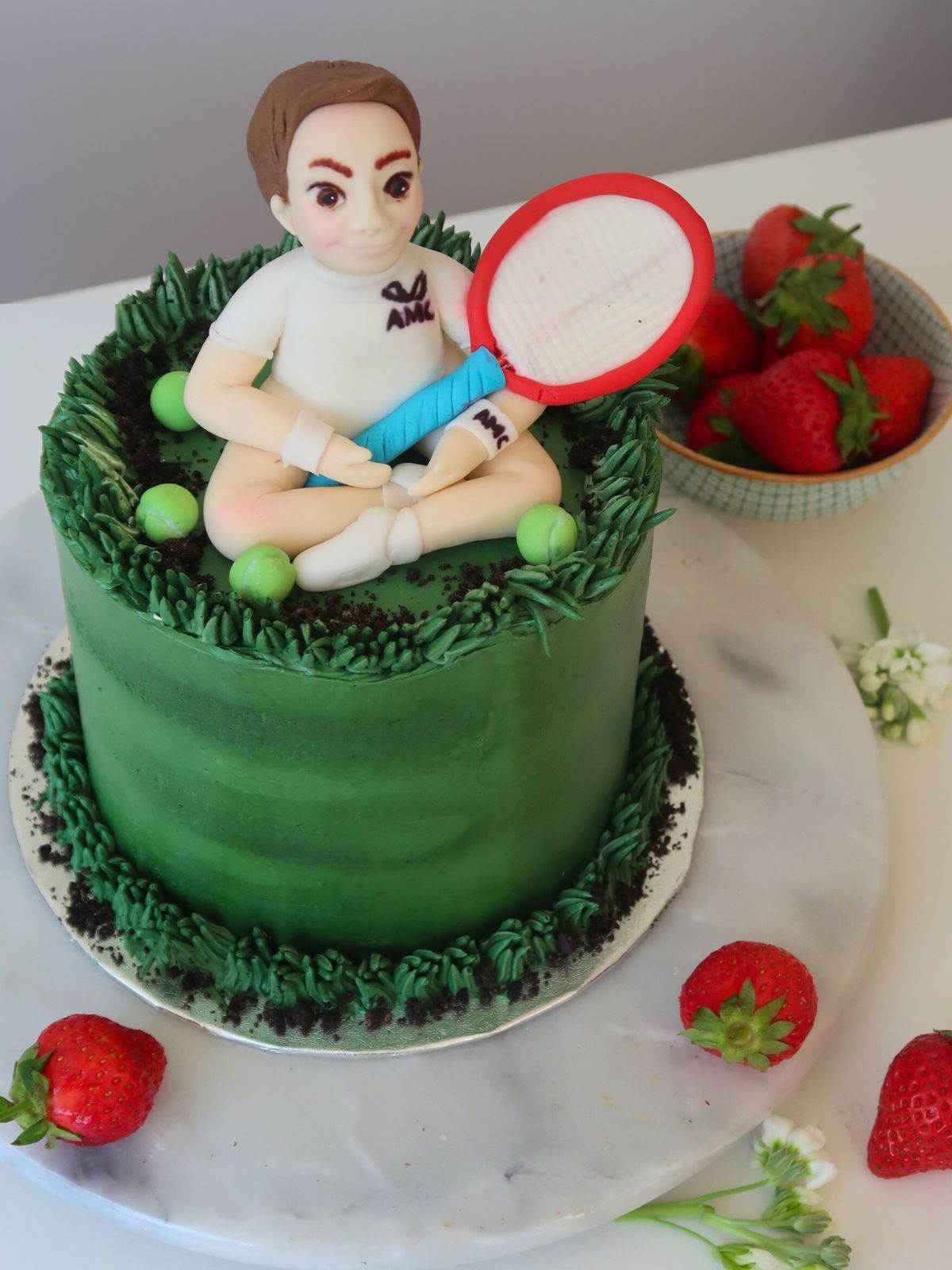 Custom tennis birthday cake with hand-modelled figurine for London and Surrey delivery