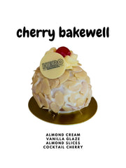 Cherry Bakewell doughnut with almond cream, vanilla glaze, almond slices, cocktail cherry, and Hero Doughnuts logo