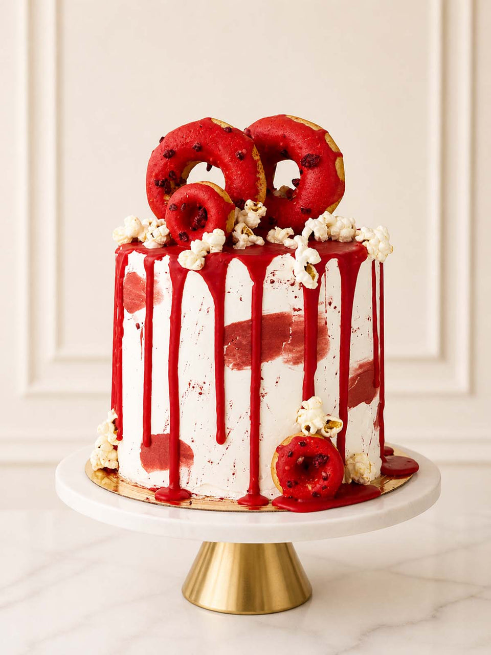 Horror-themed Dexter cake featuring realistic red sugar blood splatter and glossy drip icing, available for delivery in London.