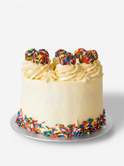 Funfetti truffle birthday cake with colourful sprinkles and buttercream frosting