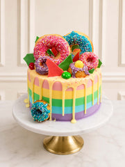 Gaga-inspired rainbow vanilla cake with doughnuts and sprinkles, London and Surrey.