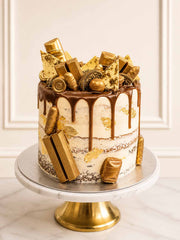 Golden treat cake with Kinder Bueno, gold leaf, and brownies, London and Surrey.