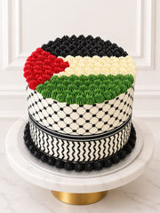 Elevated view of Keffiyeh Cake with piped buttercream and black-and-white pattern