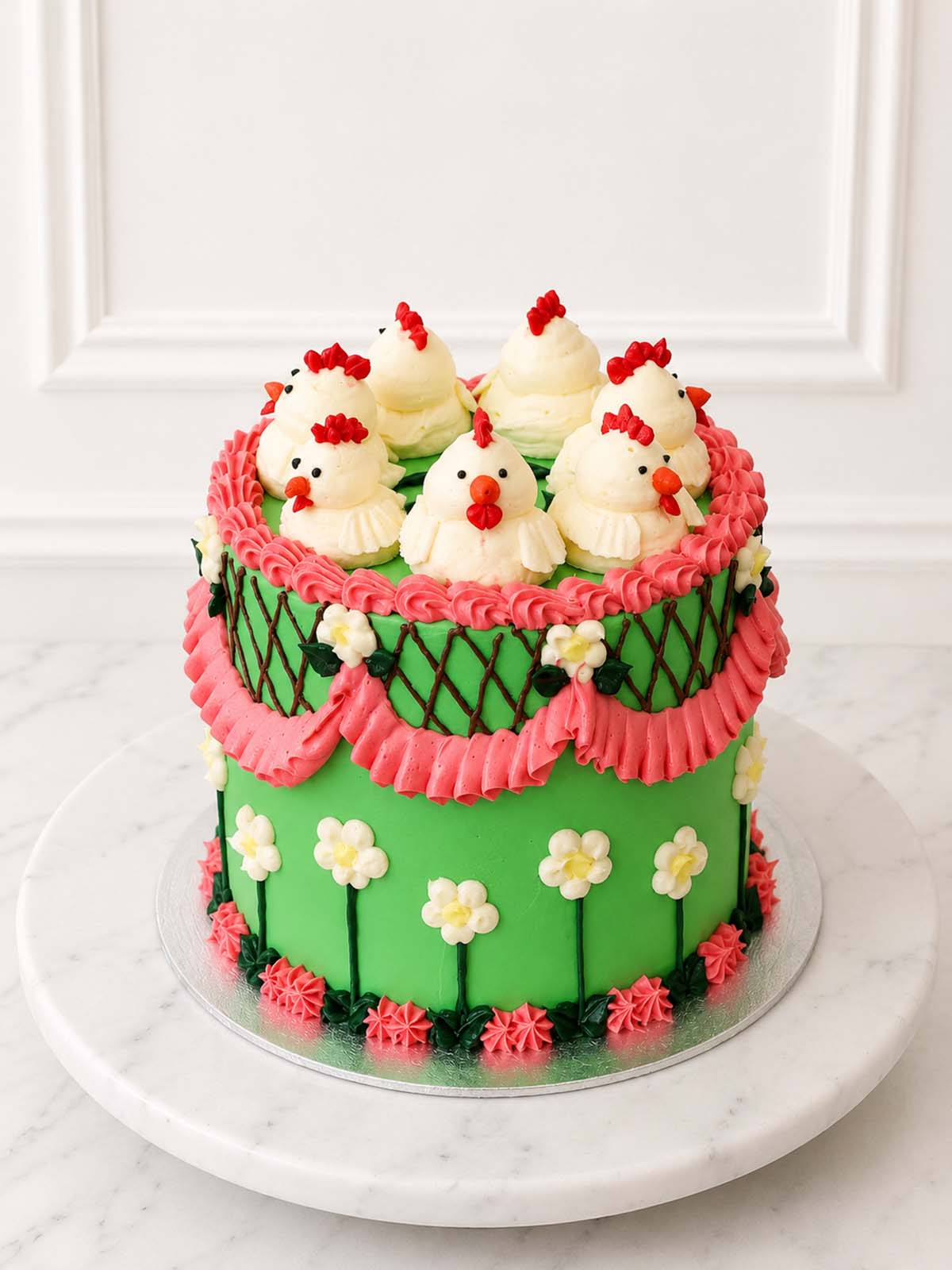 Close angled view of the Kitsch Chicken Cake decorated with hand-piped chickens, pink ruffles, blossoms and criss-cross piping.