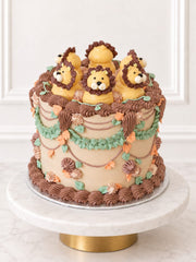 Three-quarter view of Kitsch Lion Cake with hand-piped buttercream lions