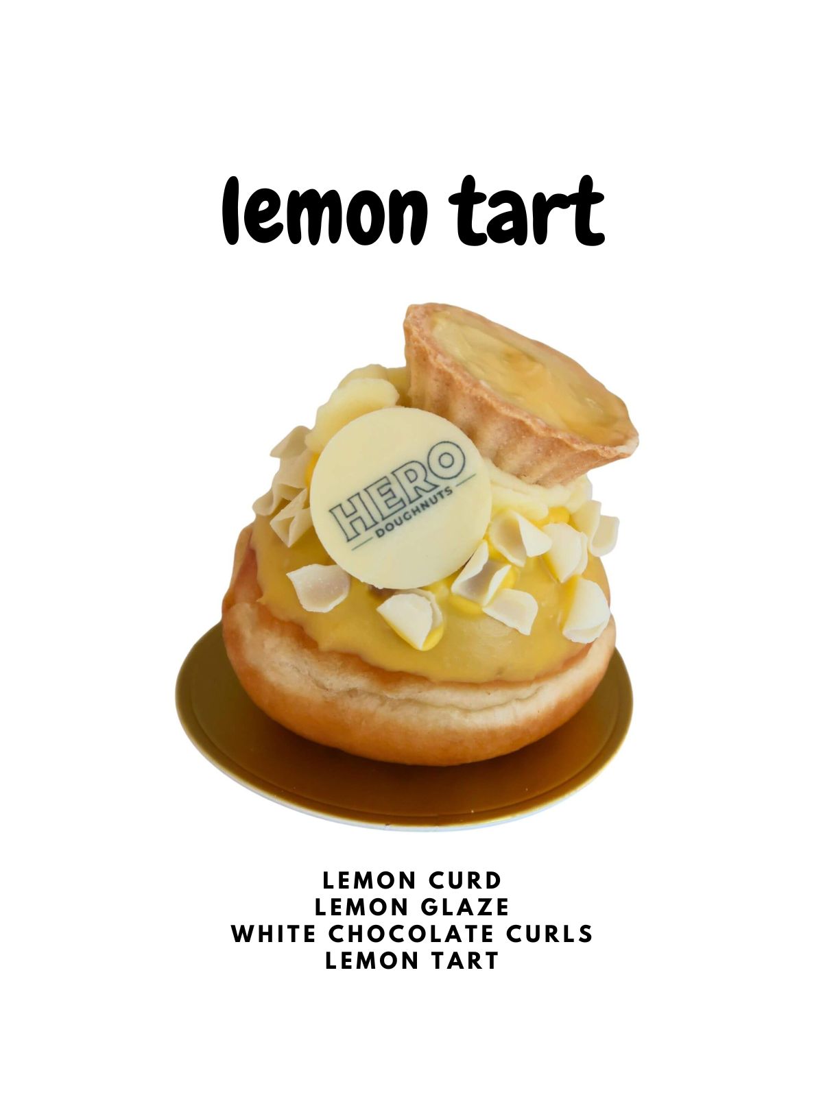 Enjoy free London delivery on a dozen Lemon Tart HERO Doughnuts—lemon tarts topped with lemon curd, lemon glaze, white chocolate curls, and a HERO disc. Perfect served with our Lemon doughnuts and displayed on an elegant gold base.