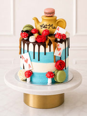 Luxury Alice in Wonderland Mad Hatter red velvet cake with teapot, London & Surrey.