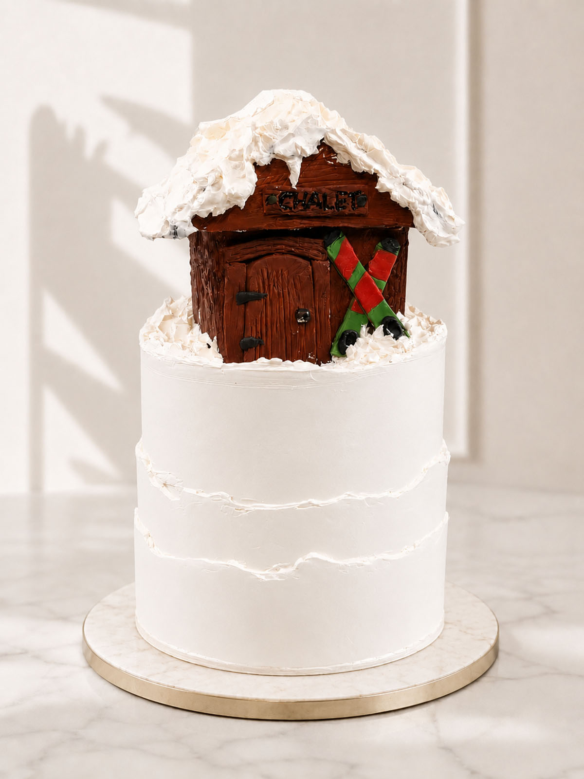 Luxury Alpine ski lodge vanilla cake with fondant skis, London & Surrey.