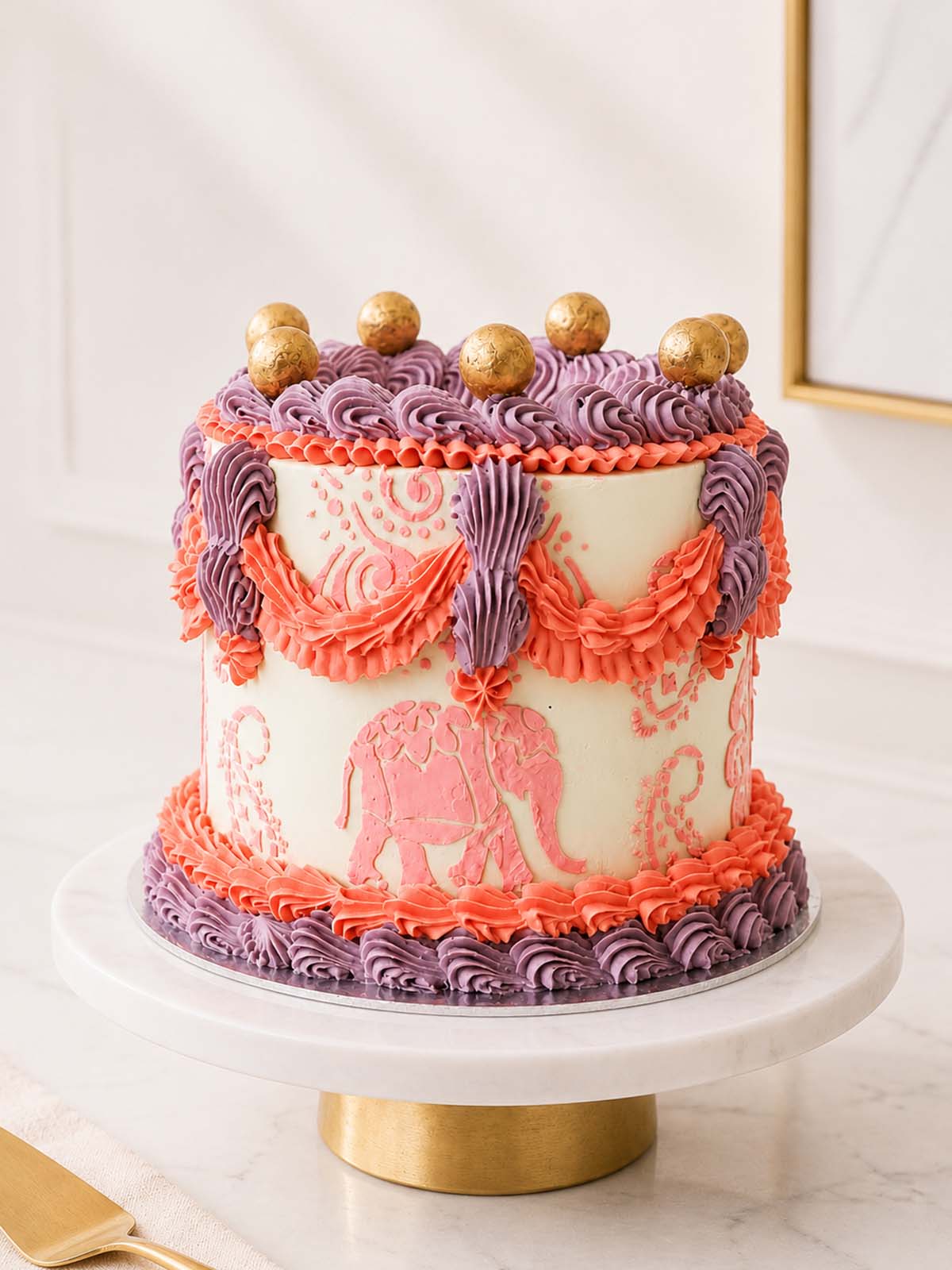 Luxury Bollywood Lambeth cake with saree-inspired paisley piping, London & Surrey.
