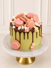 Luxury cherry blossom style matcha cake with pink macarons, London & Surrey.