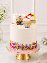 Luxury funfetti piñata cake with Smarties and mini cakes, London & Surrey.