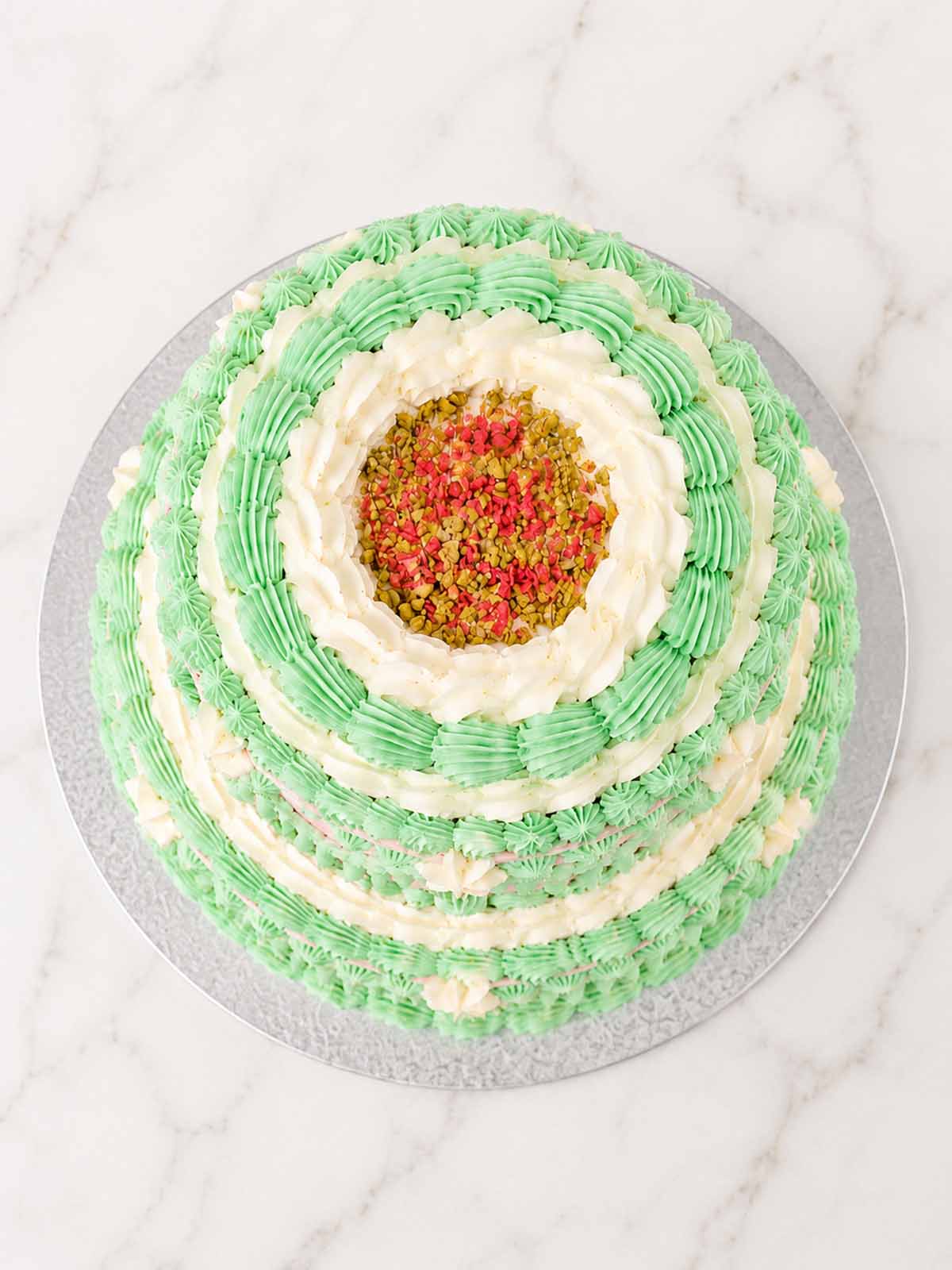 Luxury pink and green vintage piped buttercream floral pistachio cake, London & Surrey.