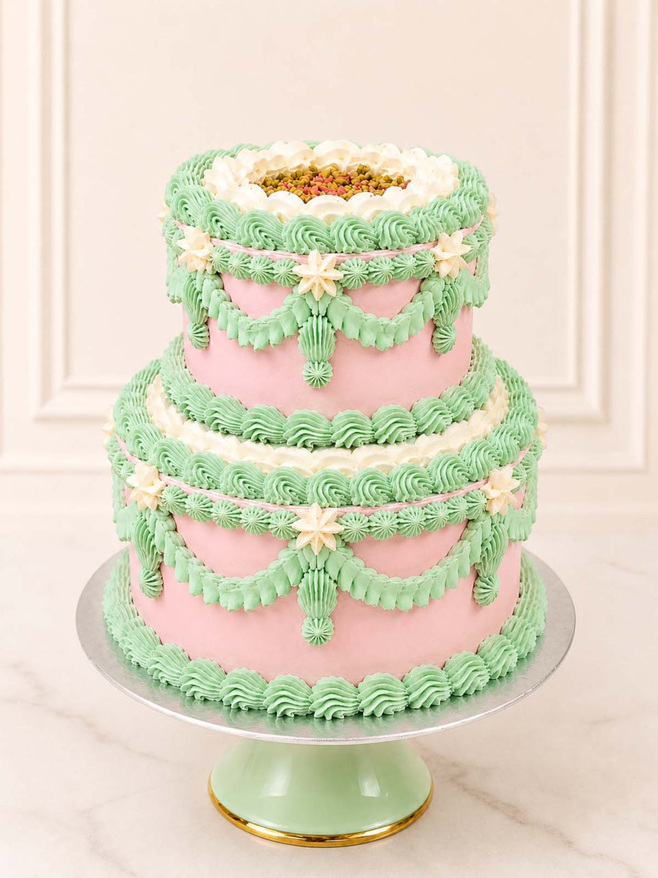 Luxury pistachio and raspberry cake with pink and green vintage piping, London & Surrey.