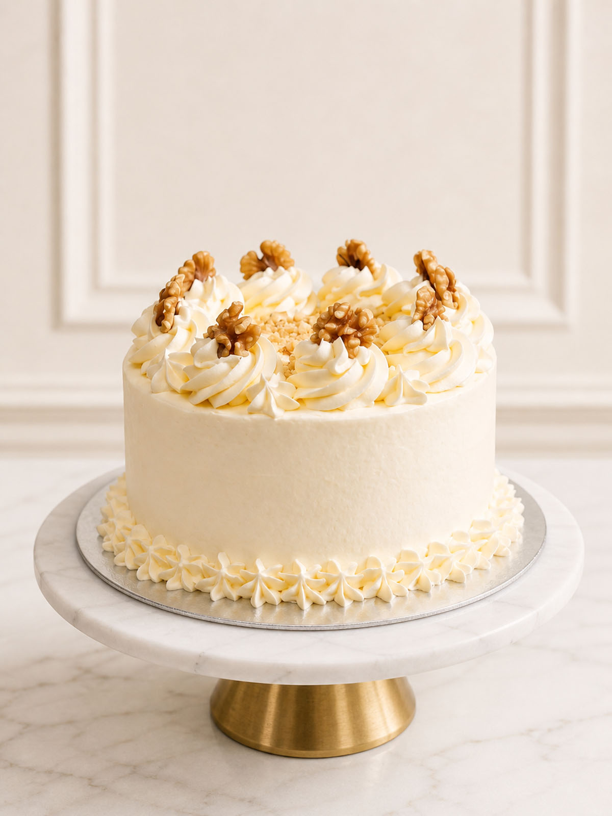 A luxury rustic carrot and walnut celebration cake featuring gently spiced sponge, silky vanilla Swiss meringue buttercream, and a textured finish of whole and crushed toasted walnuts, delivered in London.