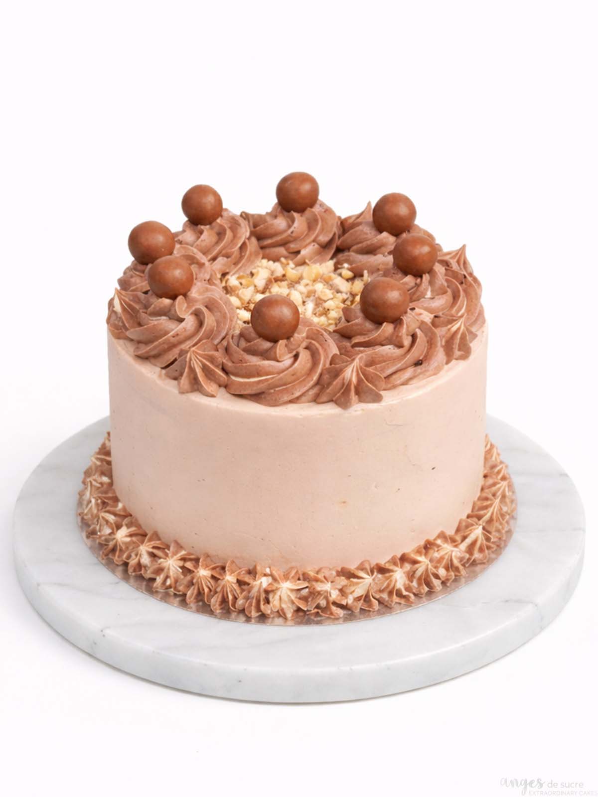 Malteser birthday cake showing chocolate buttercream and Malteser topping detail, delivered in London