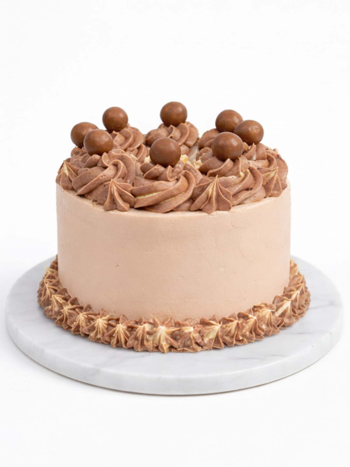 Malteser birthday cake with chocolate buttercream and Malteser topping, delivered in London