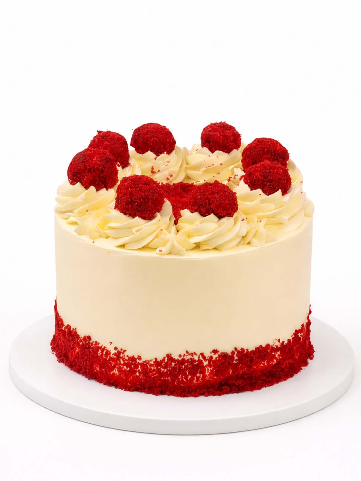 Red velvet truffle birthday cake showing smooth cream cheese frosting, delivered in London