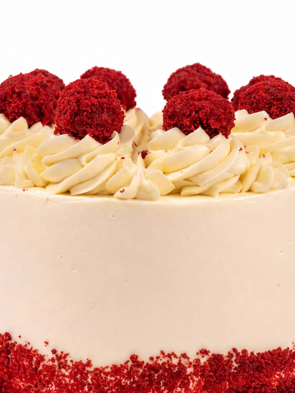 Red velvet truffle birthday cake close up deep red sponge decorations, delivered in London