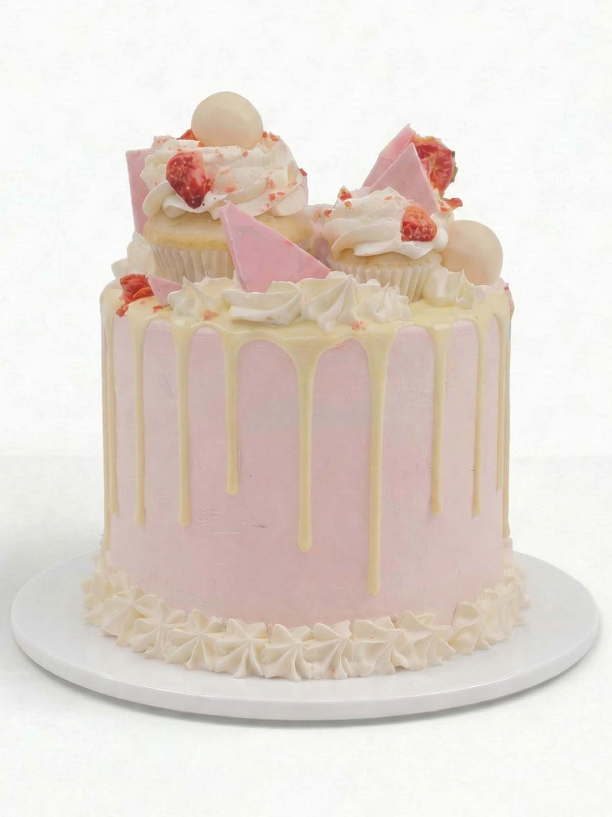 Strawberries and cream birthday cake with fresh strawberries and light buttercream, delivered in London