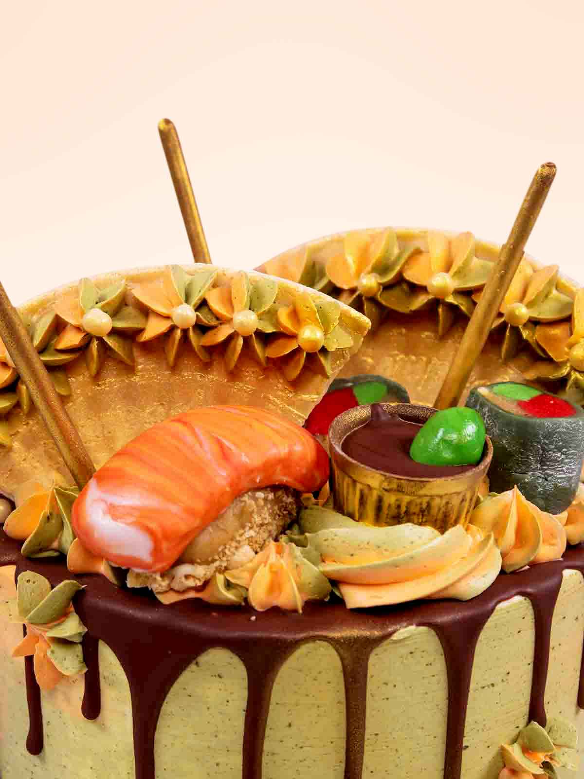 Close-up of handmade sweet sushi decorations on the birthday cake.