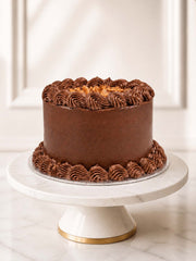 Chocolate fudge birthday cake with Belgian ganache, buttercream piping and chocolate decorations.