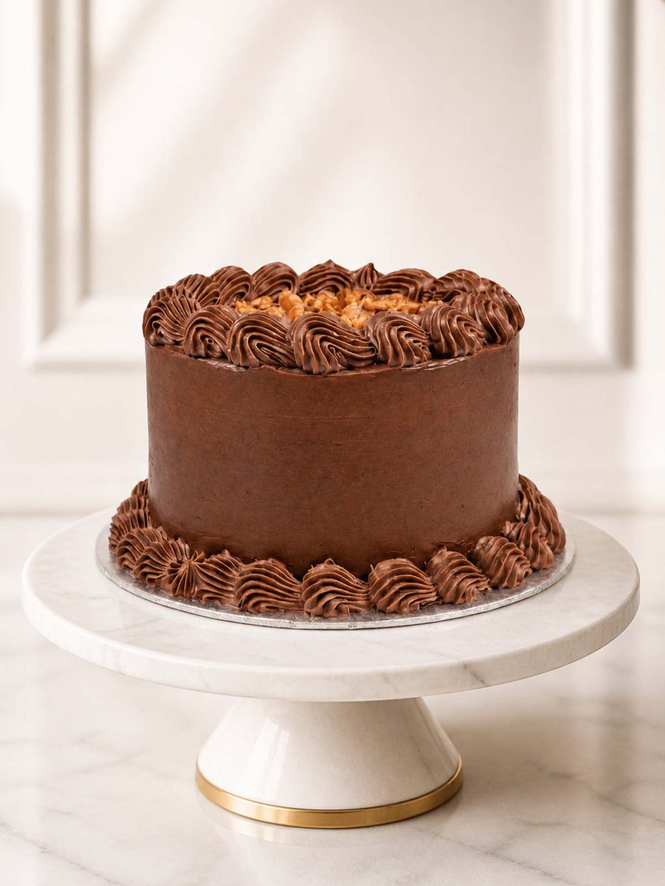 Chocolate fudge birthday cake with Belgian ganache, buttercream piping and chocolate decorations.