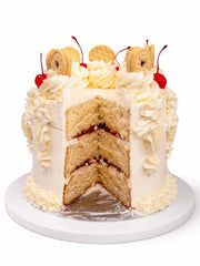 Vintage Victoria sponge birthday cake showing the interior sponges and jam filling, delivered in London