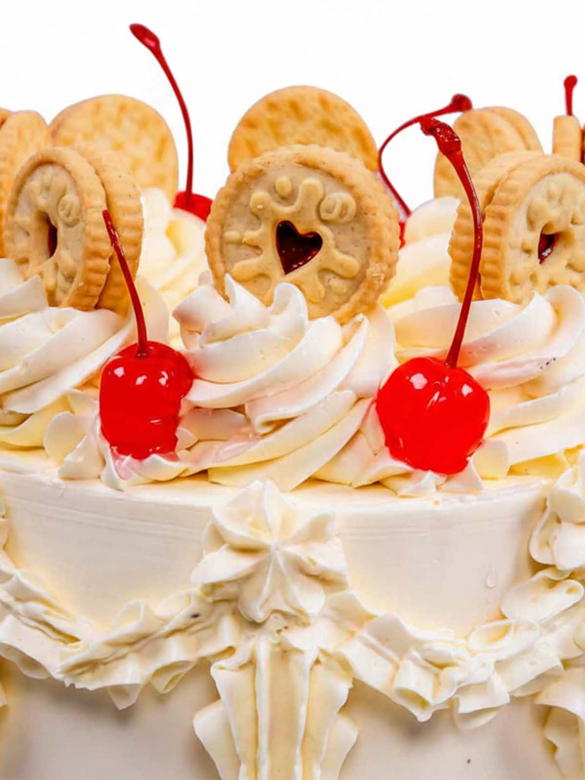 Close up of the Vintage Victoria sponge birthday cake showing intricate piping and classic finish, delivered in London